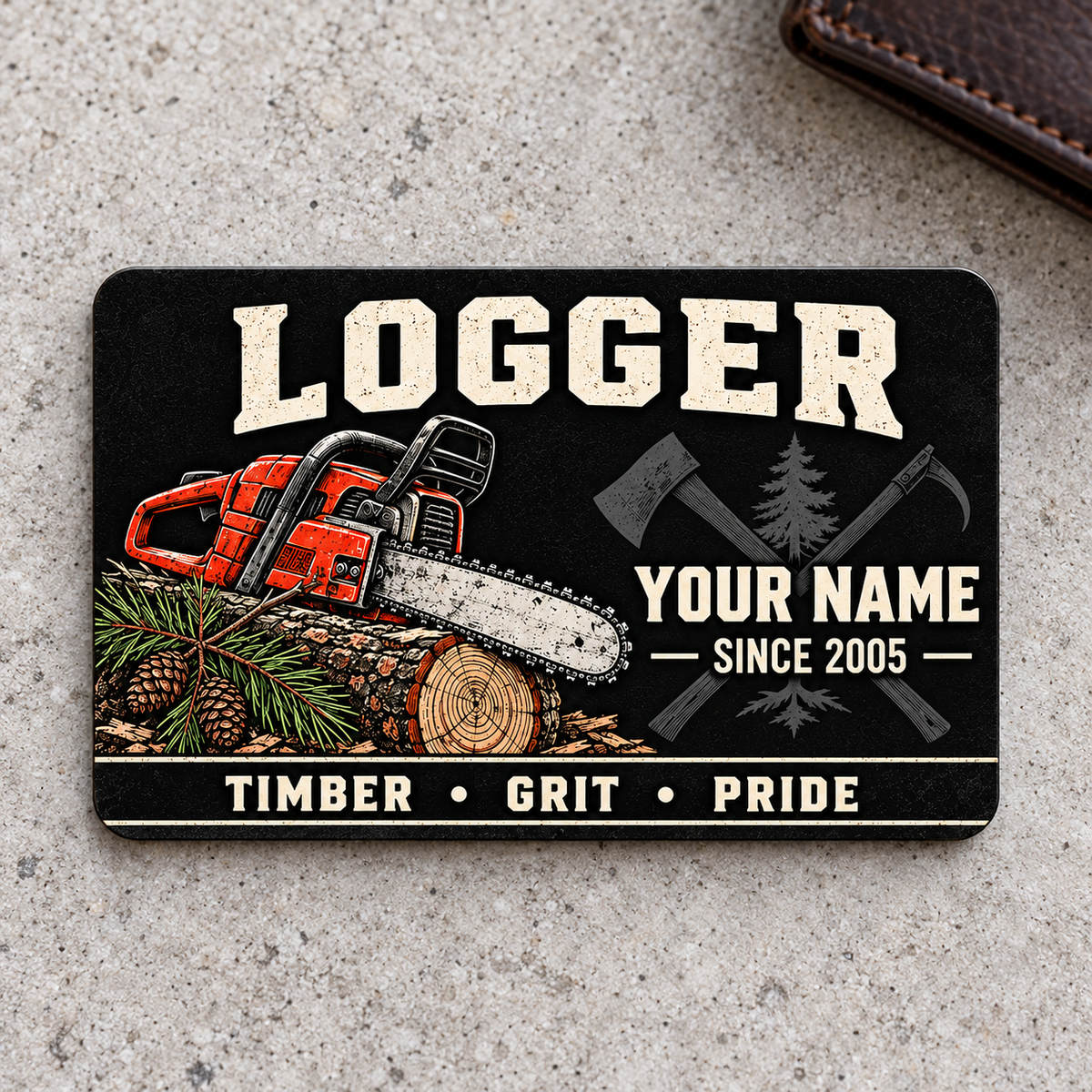 Logger Midnight Pride aluminum wallet card on light gray concrete.