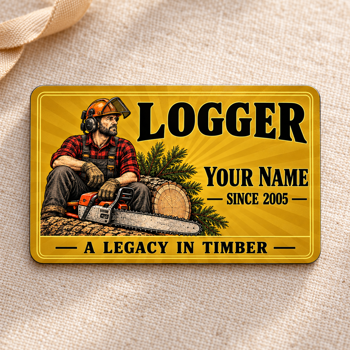 Logger Golden Milestone aluminum wallet card on cream linen.