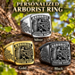 Arborist Black Face Badge personalized ring in Silver, Gold and Black with CUSTOM NAME and SINCE 2000 on a arborist-themed background