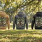 Arborist Walk the Walk Badge Vintage Hoodies in Military Green, Kaki, Dark Gray, Black and Dark Blue, five complete back views under a living tree canopy with coiled rope and a sheathed pruning saw at rest.