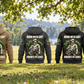 Five complete back views of the Arborist By Choice Vintage Hoodie in Military Green, Kaki, Dark Gray, Black and Dark Blue, arranged separately beneath living trees with arborist equipment resting nearby.