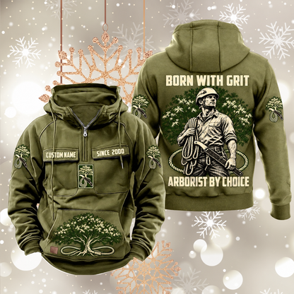 Arborist By Choice Vintage Hoodie in Military Green, front and back views with sample text CUSTOM NAME and SINCE 2000, tree-care motifs, and BORN WITH GRIT / ARBORIST BY CHOICE back artwork.