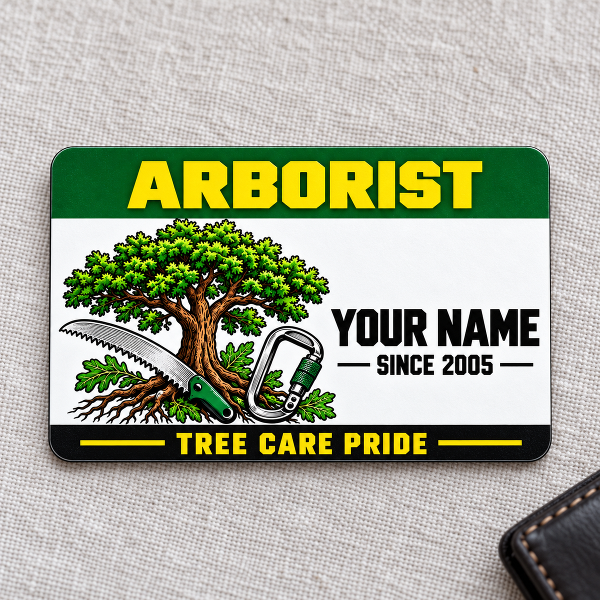 Arborist Green Band aluminum wallet card, front view on pale gray cloth.