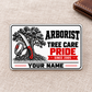 Front of the Arborist Honeycomb Pride aluminum wallet card on oatmeal linen.