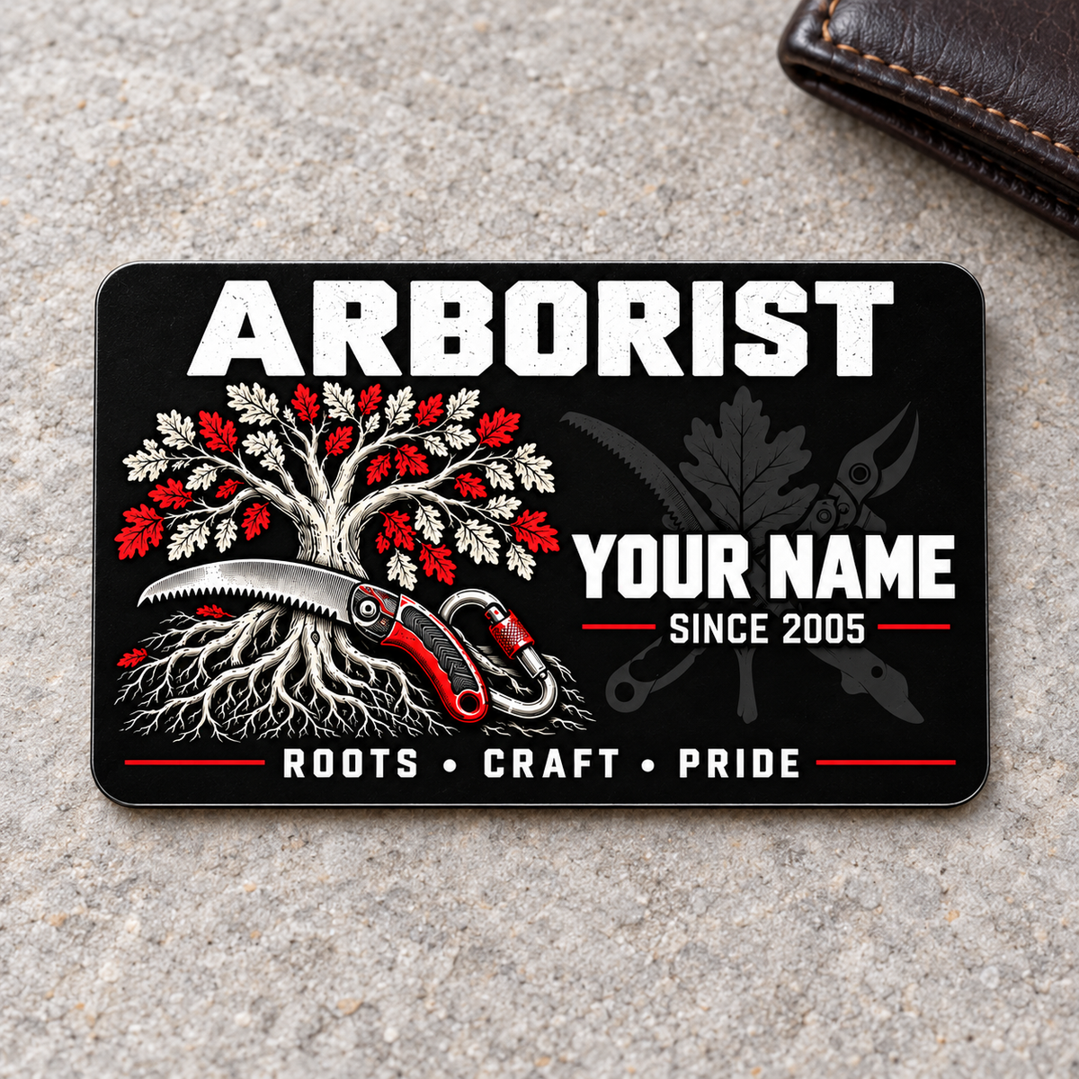 Arborist Midnight Pride aluminum wallet card, front view on light gray stone.