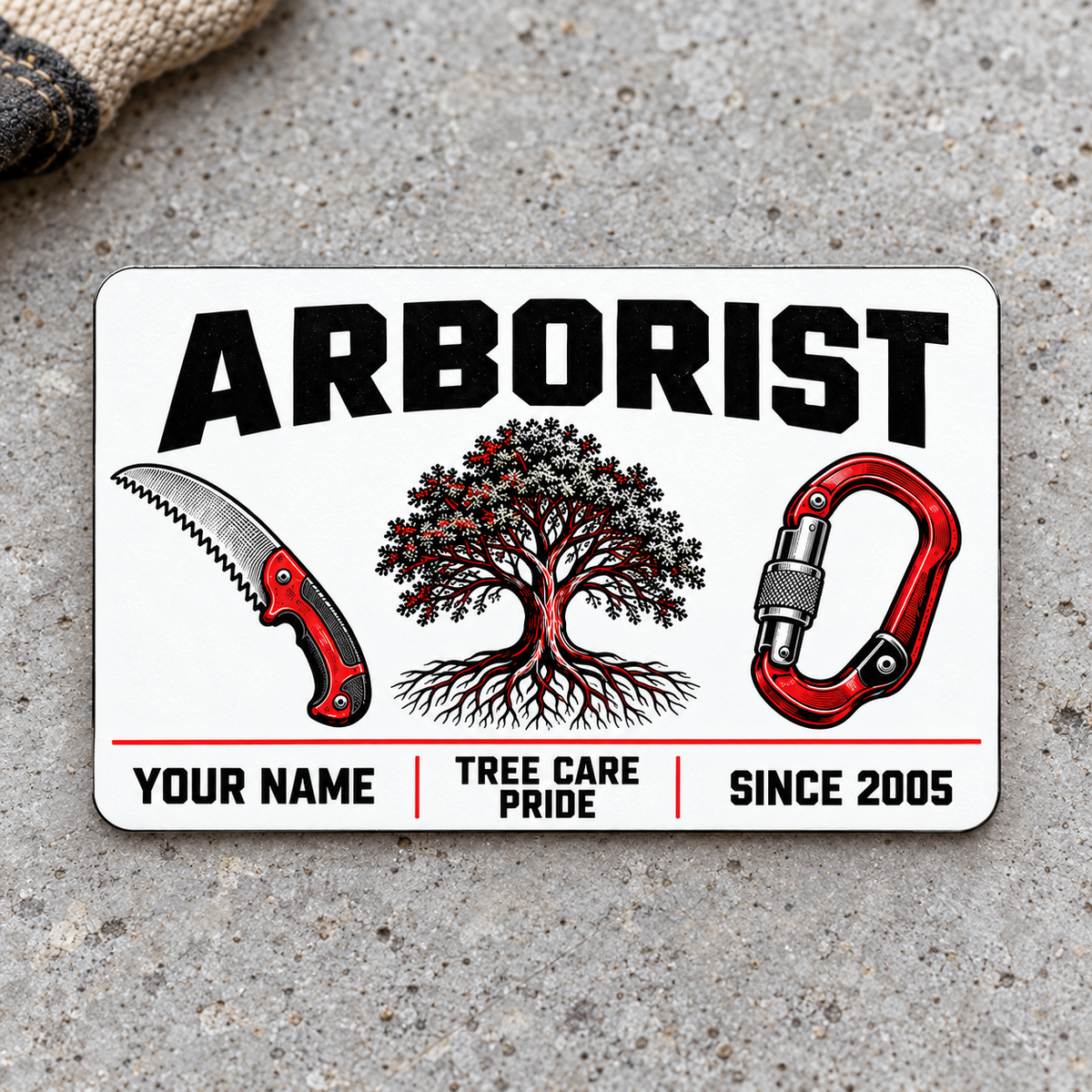 Front of the Arborist Minimal Tool Grid aluminum wallet card on light concrete.