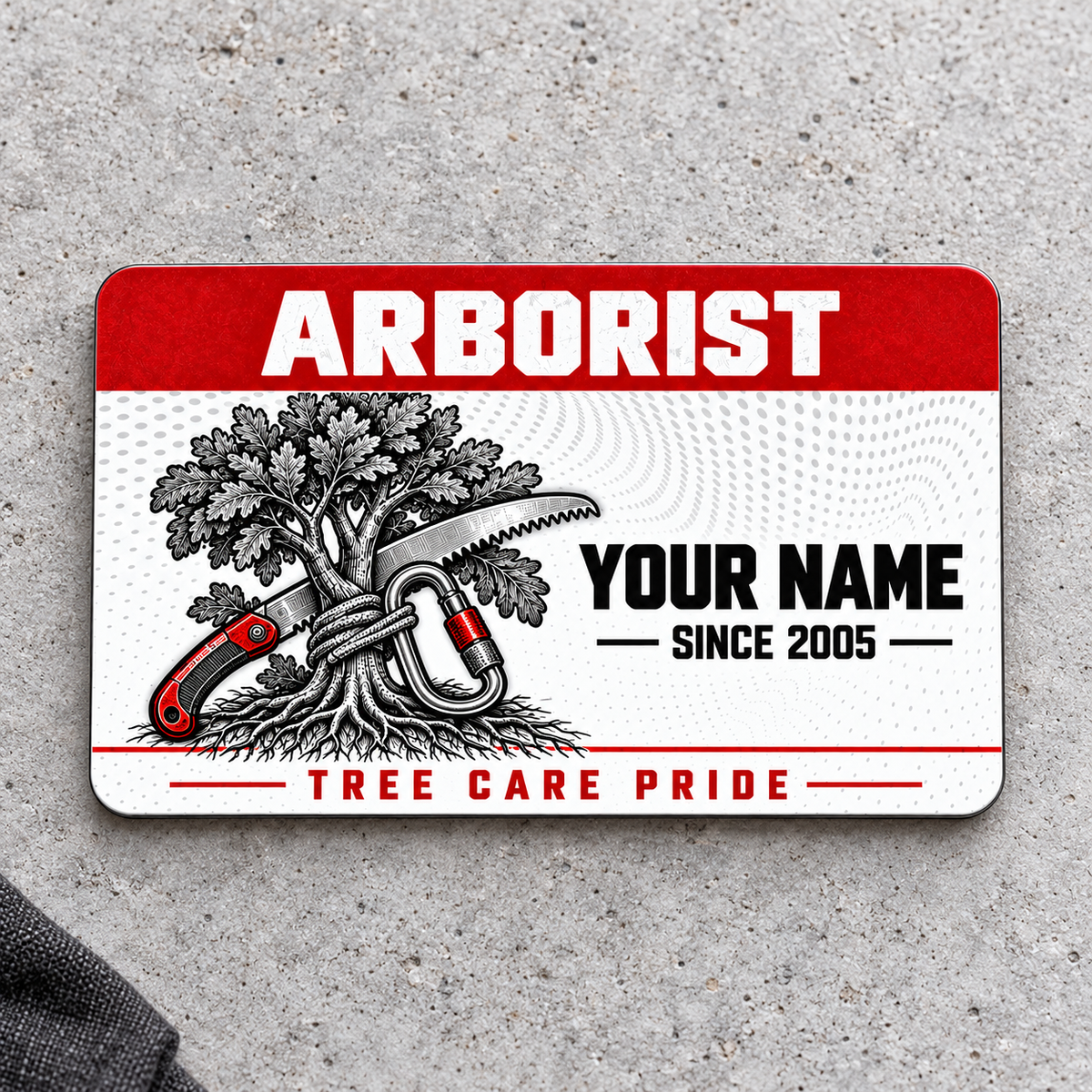 Front of the Arborist Red Header aluminum wallet card on light concrete.