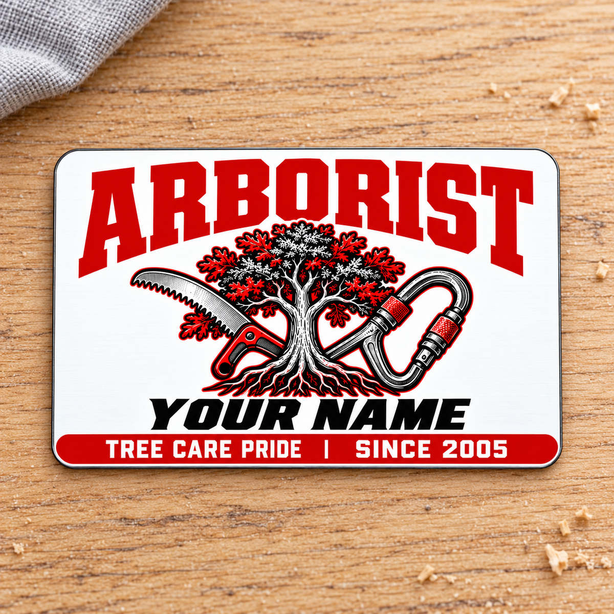 Arborist Signature Modern aluminum wallet card, front view on pale oak.