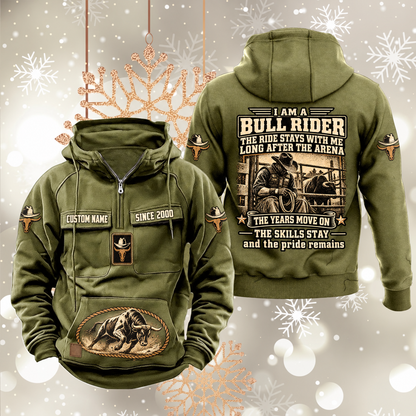 Bull Rider Skills and Pride Vintage Hoodie in Military Green, front and back views with sample chest text CUSTOM NAME and SINCE 2000, hat-and-bull sleeve symbols, rope-bordered bull pouch motif and rider portrait statement on the back.