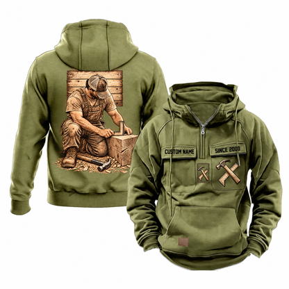 Carpenter Ready Every Day Portrait Vintage Hoodie in Military Green, front and back views with sample text CUSTOM NAME and SINCE 2000, crossed hammer-and-square chest emblems and a kneeling carpenter back illustration.