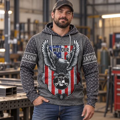 Personalized welder hoodie featuring grey american eagle shield all-over print, worn by a model
