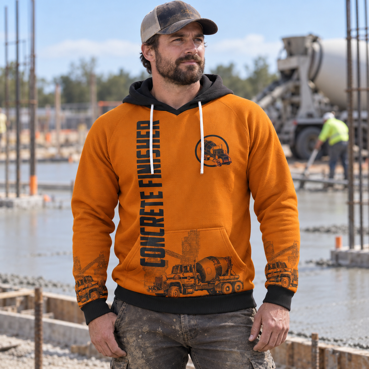 Concrete finisher hoodie featuring orange concrete mixer and illustrated back panel all-over print, worn by a model