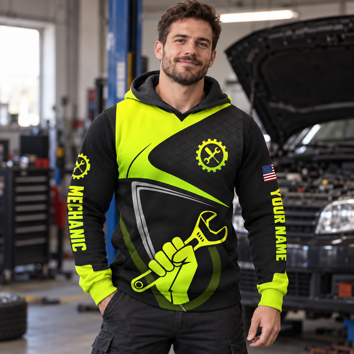 Personalized mechanic hoodie featuring neon yellow black wrench fist all-over print, worn by a model