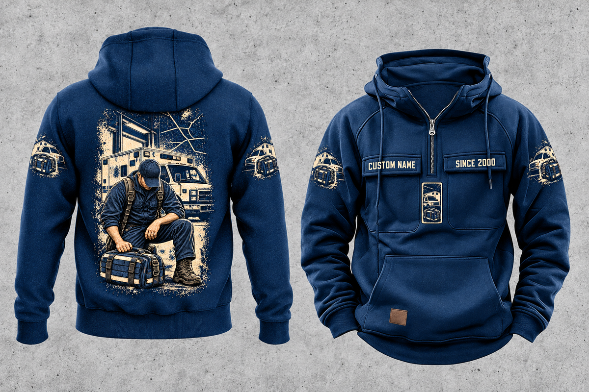 EMS Daily Commitment Portrait Vintage Hoodie in Dark Blue, separated front and back views with sample text CUSTOM NAME and SINCE 2000, generic ambulance-and-response-bag sleeve motifs, and a kneeling worker back illustration.