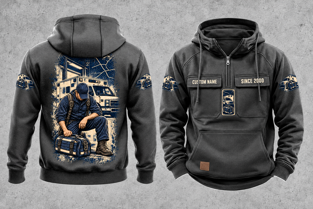 EMS Daily Commitment Portrait Vintage Hoodie in Dark Gray, separated front and back views with sample text CUSTOM NAME and SINCE 2000, generic ambulance-and-response-bag sleeve motifs, and a kneeling worker back illustration.