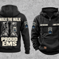 EMS Proud Walk Vintage Hoodie in Black, complete front and back views with CUSTOM NAME and SINCE 2000 chest samples, generic ambulance and response-bag motifs, and I WALK THE WALK / PROUD / EMS boot artwork.