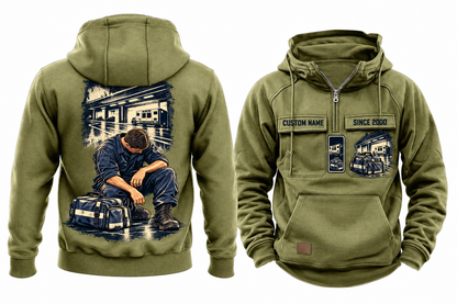 EMS Ready Every Day Portrait Vintage Hoodie in Military Green, fully separated front and back views with sample text CUSTOM NAME and SINCE 2000, ambulance and closed response bag chest artwork, and a larger kneeling worker below a compact ambulance-bay back panel.