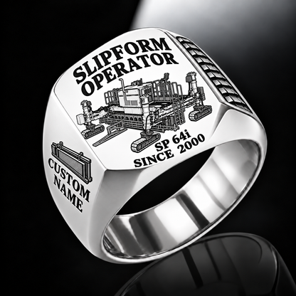Silver personalized SP 64i concrete slipform paver operator signet ring with flat machine artwork and SLIPFORM OPERATOR, SP 64i, CUSTOM NAME and SINCE 2000 engraving.