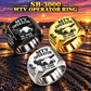 Three personalized SB-3000 material transfer vehicle operator signet rings in Silver, Gold and Black finishes, with MTV OPERATOR, SB-3000, CUSTOM NAME and SINCE 2000 engraving.