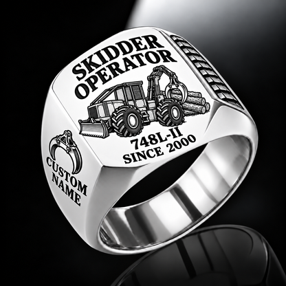 John Deere 748L-II Skidder Operator Ring in Silver finish, flat engraving showing rear timber grapple and front push blade, CUSTOM NAME and SINCE 2000.