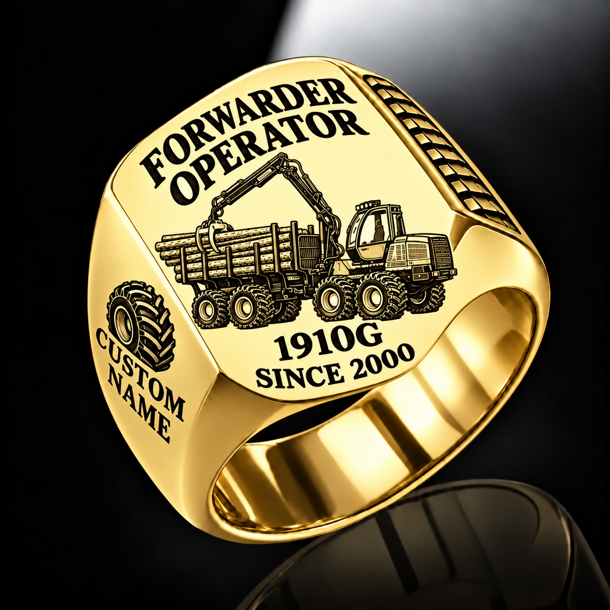 John Deere 1910G Forwarder Operator Ring in Gold finish, flat engraving showing plain log grapple and loaded stake-sided timber bunk, CUSTOM NAME and SINCE 2000.