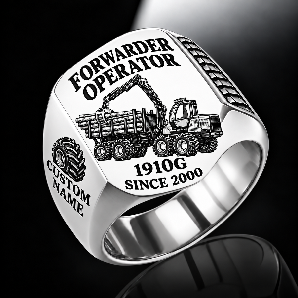 John Deere 1910G Forwarder Operator Ring in Silver finish, flat engraving showing plain log grapple and loaded stake-sided timber bunk, CUSTOM NAME and SINCE 2000.