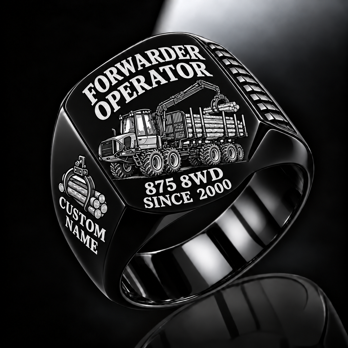 Komatsu 875 8WD Forwarder Operator Ring in Black finish, flat engraving showing plain log grapple and loaded stake-sided timber bunk, CUSTOM NAME and SINCE 2000.