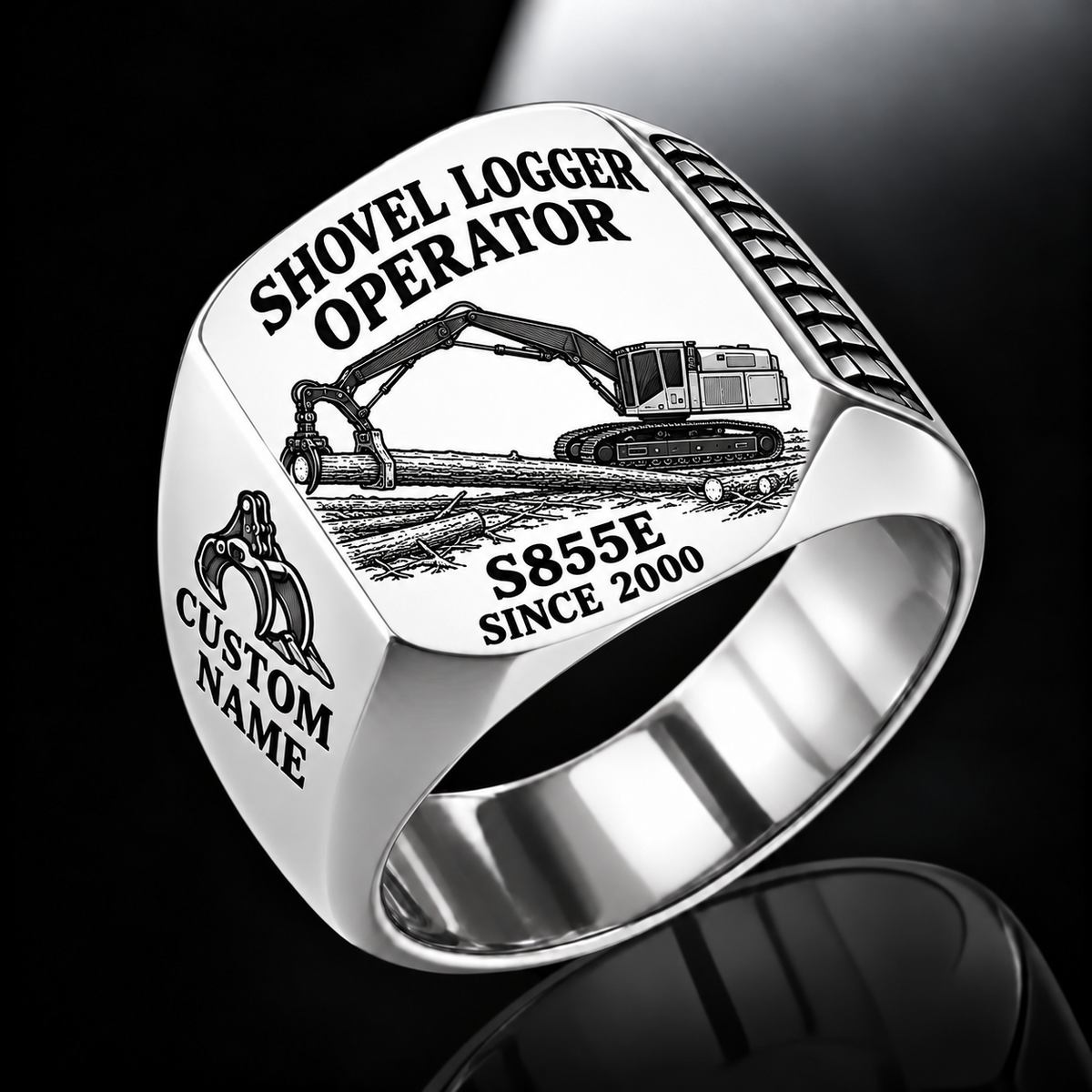 Tigercat S855E Shovel Logger Operator Ring in Silver finish, flat engraving showing connected live-heel frame and timber grapple supporting a whole stem, CUSTOM NAME and SINCE 2000.