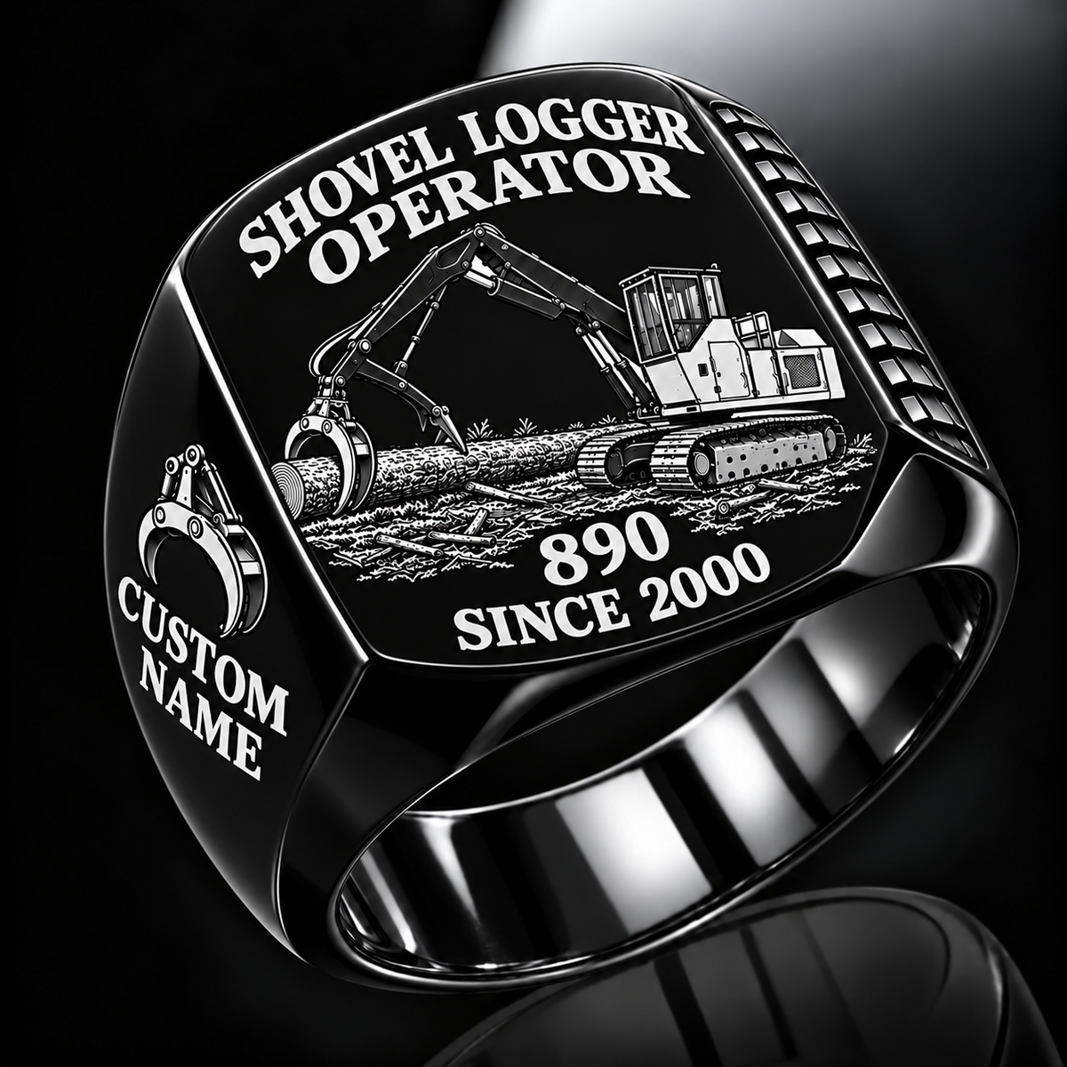 Tigercat 890 Shovel Logger Operator Ring in Black finish, flat engraving showing connected live-heel frame and timber grapple supporting a whole stem, CUSTOM NAME and SINCE 2000.