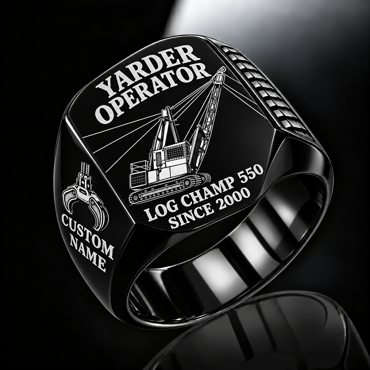 T-MAR Log Champ 550 Yarder Operator Ring in Black finish, flat engraving showing lattice boom, sheaves and cable rigging, CUSTOM NAME and SINCE 2000.