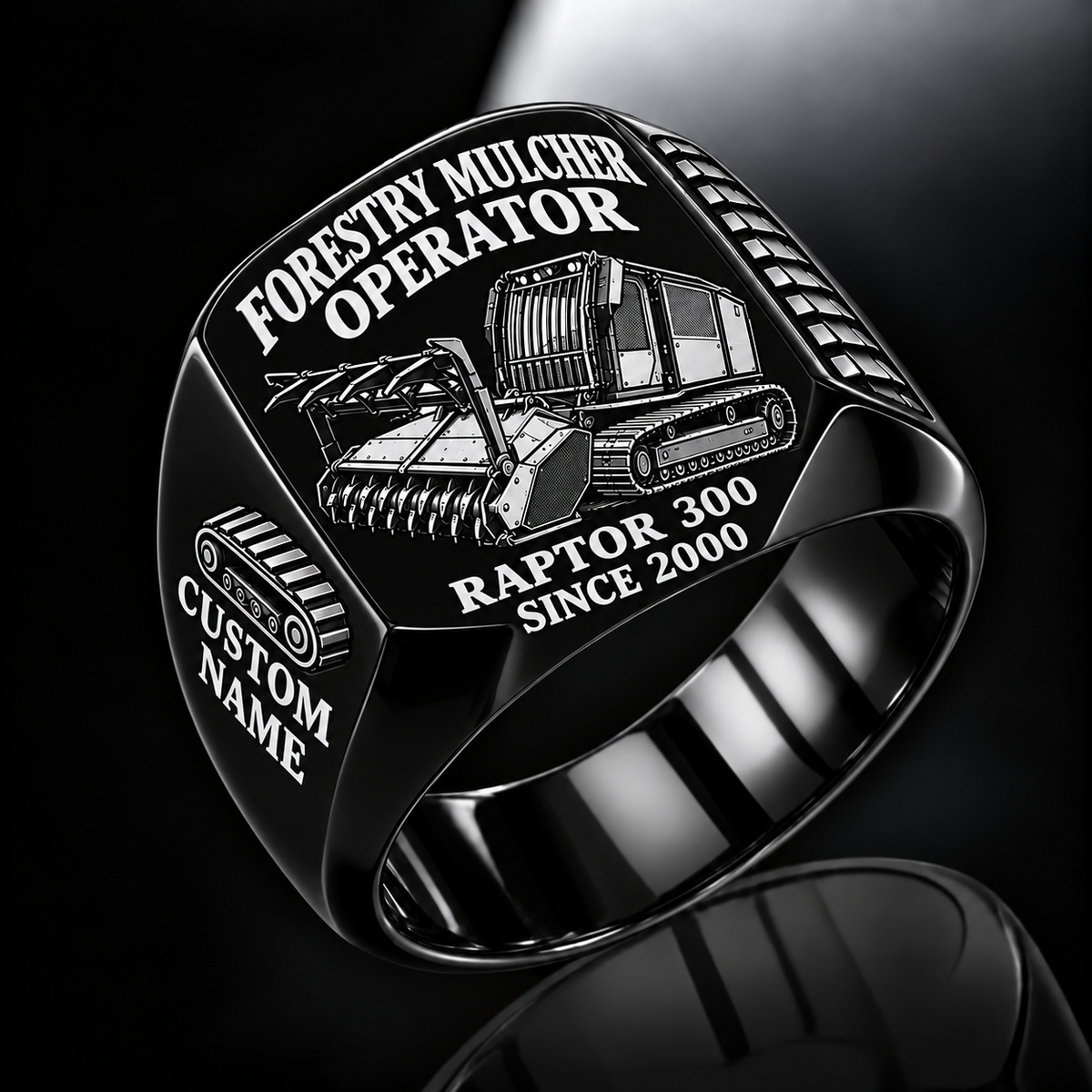 Prinoth Raptor 300 Forestry Mulcher Operator Ring in Black finish, flat engraving showing front horizontal toothed mulching drum and push bar, CUSTOM NAME and SINCE 2000.