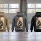 Five separate complete back views of the Firefighter Workday Portrait Vintage Hoodie in Military Green, Kaki, Dark Gray, Black and Dark Blue, arranged in a quiet firehouse bay with generic equipment at rest.