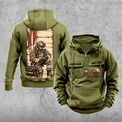 Firefighter Workday Portrait Vintage Hoodie in Military Green, front and back views with sample chest text CUSTOM NAME and SINCE 2000, helmet and crossed-axes chest artwork, plain sleeves and pouch, and a tall kneeling-firefighter back illustration.