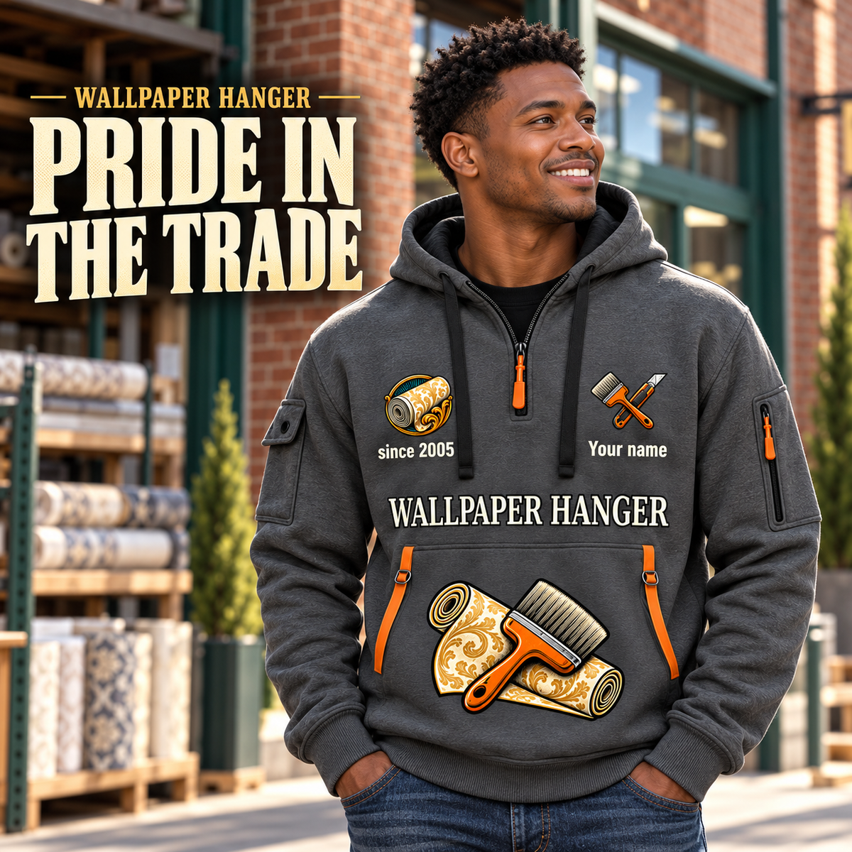 Wallpaper Hanger Pride in the Trade Quarter-Zip Hoodie in Gray, worn by an adult male model, preserving the current niche artwork, sample name and year, and hooded quarter-zip garment details.
