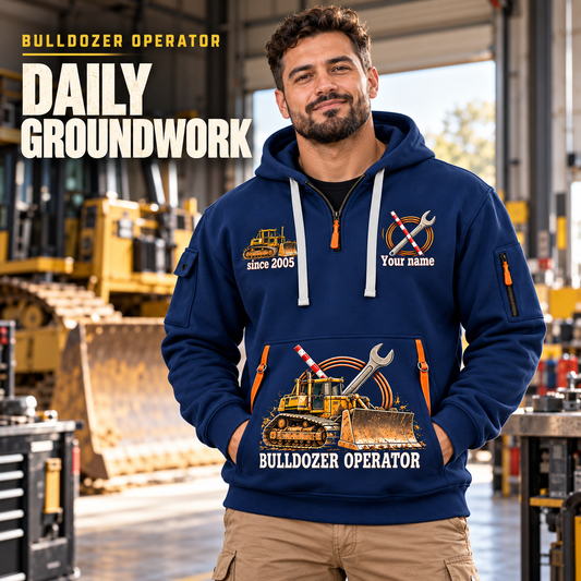 Bulldozer Operator Daily Groundwork Quarter-Zip Hoodie in Navy, worn by an adult male model, preserving the current niche artwork, sample name and year, and hooded quarter-zip garment details.