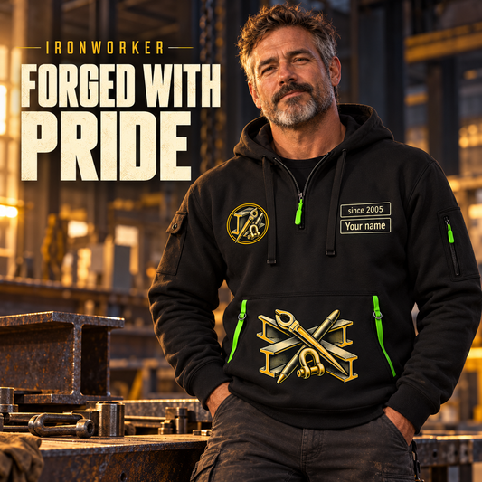 Ironworker Forged With Pride Quarter-Zip Hoodie in Black, worn by an adult male model, preserving the current niche artwork, sample name and year, and hooded quarter-zip garment details.