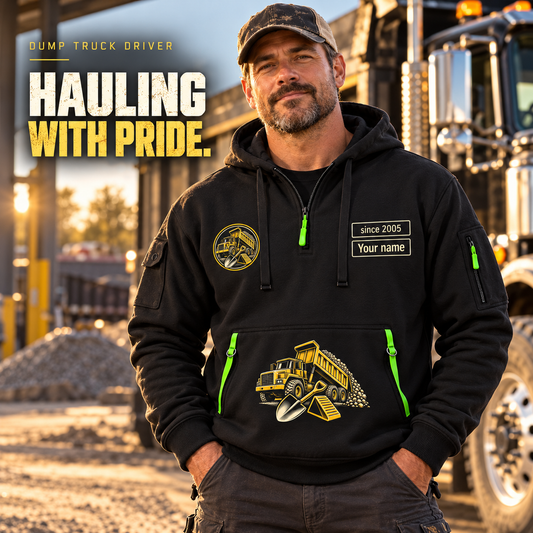 Dump Truck Driver Hauling With Pride Quarter-Zip Hoodie in Black, worn by an adult male model, preserving the current niche artwork, sample name and year, and hooded quarter-zip garment details.