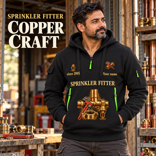 Sprinkler Fitter Copper Craft Quarter-Zip Hoodie in Black, worn by an adult male model, preserving the current niche artwork, sample name and year, and hooded quarter-zip garment details.