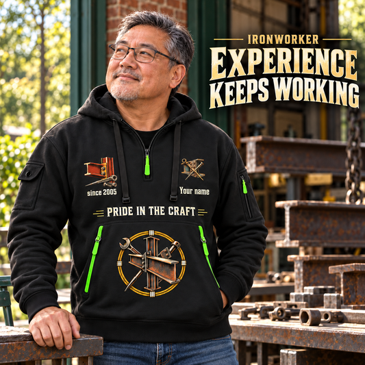 Ironworker Experience Keeps Working Quarter-Zip Hoodie in Black, worn by an adult male model, preserving the current niche artwork, sample name and year, and hooded quarter-zip garment details.