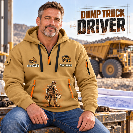 Dump Truck Driver Blueprint Quarter-Zip Hoodie in Khaki, worn by an adult male model, preserving the current niche artwork, sample name and year, and hooded quarter-zip garment details.
