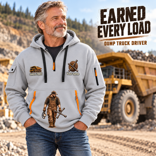 Dump Truck Driver Earned Every Load Quarter-Zip Hoodie in Light Grey, worn by an adult male model, preserving the current niche artwork, sample name and year, and hooded quarter-zip garment details.
