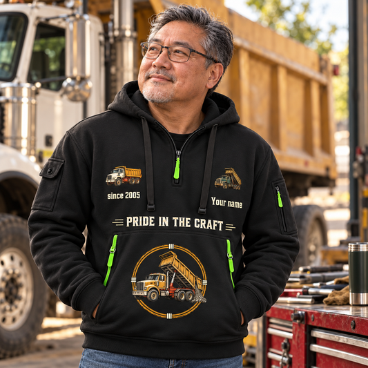 Dump Truck Driver Experience Keeps Working Quarter-Zip Hoodie in Black, worn by an adult male model, preserving the current niche artwork, sample name and year, and hooded quarter-zip garment details.