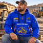 Dump Truck Driver Hands That Power Quarter-Zip Hoodie in Blue, worn by an adult male model, preserving the current niche artwork, sample name and year, and hooded quarter-zip garment details.