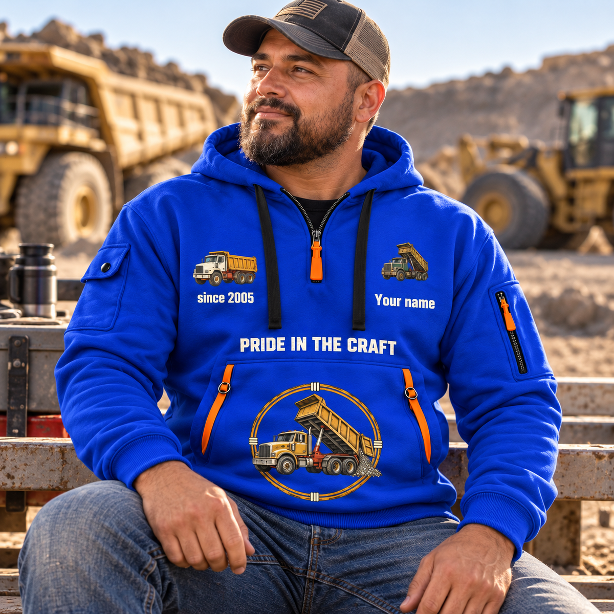 Dump Truck Driver Hands That Power Quarter-Zip Hoodie in Blue, worn by an adult male model, preserving the current niche artwork, sample name and year, and hooded quarter-zip garment details.