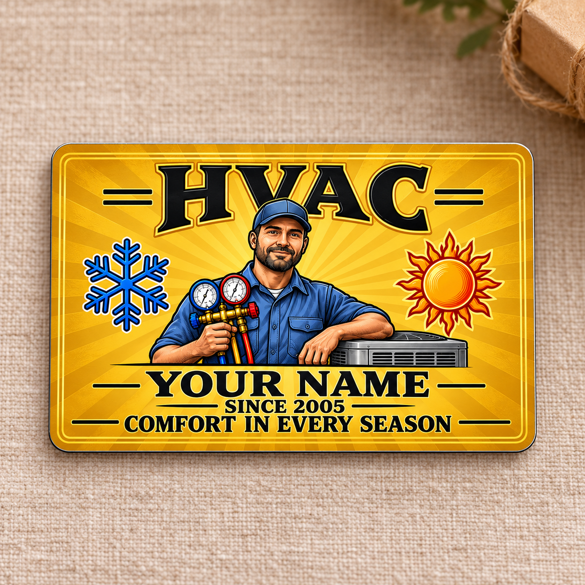 HVAC Aluminum Wallet Card - Golden Milestone front on a subtle tabletop.