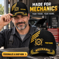 Mechanic wearing the personalized Asymmetric Gold cap with product close-up and shopping CTA