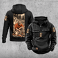 Logger Daily Commitment Portrait Vintage Hoodie in Black, front and back views with CUSTOM NAME and SINCE 2000 sample tabs, small logging-tool sleeve motifs and a tall kneeling logger and cut-timber back illustration.