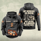 Logger Never Ends Vintage Hoodie in Dark Gray, front and back views with CUSTOM NAME and SINCE 2000 chest samples, cut-timber and crosscut-saw front artwork, and boots-and-axe Logger back graphic.