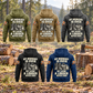Five complete back views of the Logger Never Ends Vintage Hoodie in Military Green, Kaki, Dark Gray, Black and Dark Blue, arranged at a quiet forest landing with stacked cut timber and an axe at rest.