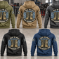 Five complete back views of Mechanic Walk the Walk Badge Vintage Hoodie in Military Green, Kaki, Dark Gray, Black and Dark Blue, arranged in a quiet vehicle workshop with arched I WALK THE WALK and WITH MECHANIC PRIDE boots artwork.